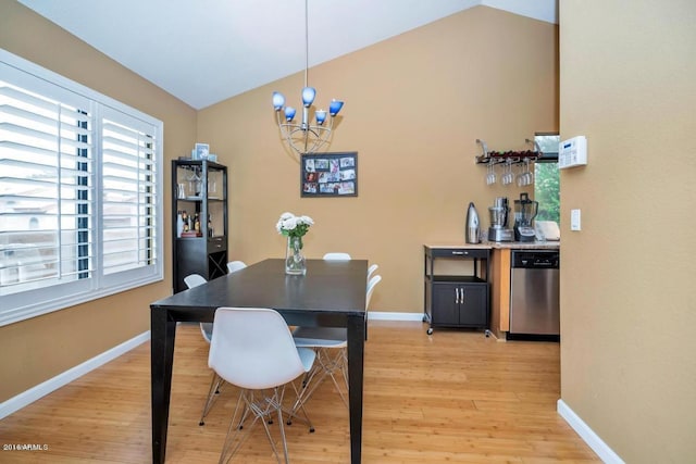 5640 E Bell Rd Unit 1099, Scottsdale, AZ 85254 - dining room with lofted ceiling, light wood-style floors, and a chandelier