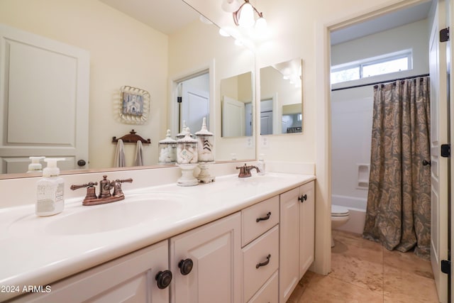 full bathroom featuring shower / tub combo, vanity, and toilet