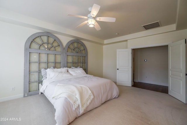 bedroom featuring ceiling fan and light colored carpet