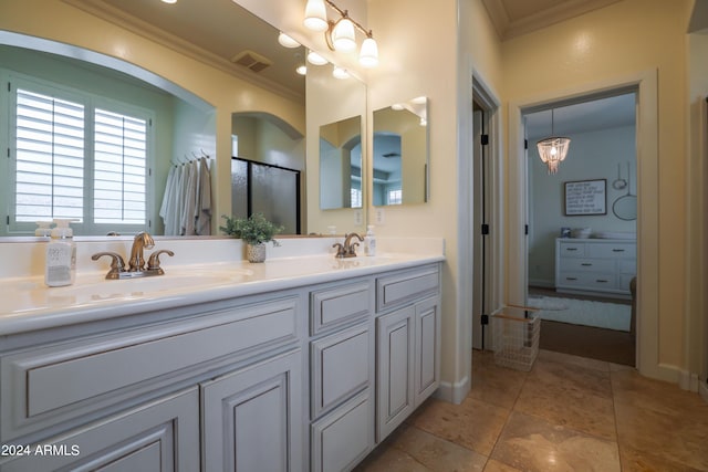 bathroom featuring ornamental molding, tile patterned flooring, and vanity