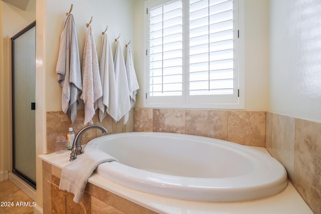 bathroom with independent shower and bath