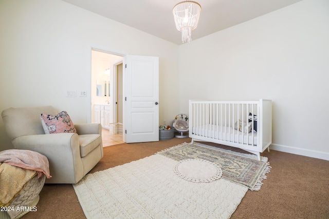 bedroom with a notable chandelier, carpet, and lofted ceiling