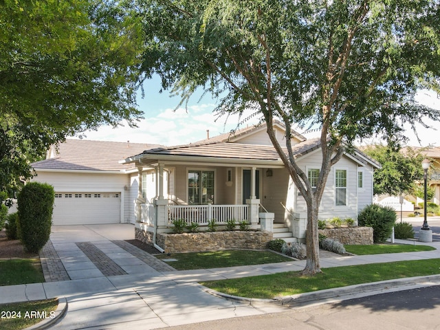 view of front facade featuring a garage and covered porch