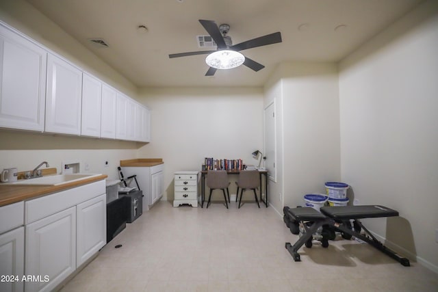 interior space featuring sink and ceiling fan