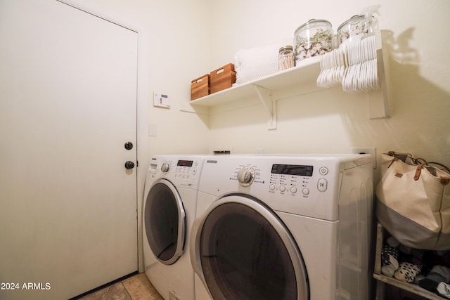 laundry room with washing machine and clothes dryer