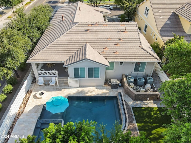 back of house with a patio area and a fire pit