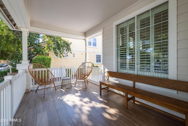 wooden deck featuring covered porch