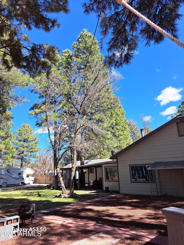 exterior space with a front yard and fence