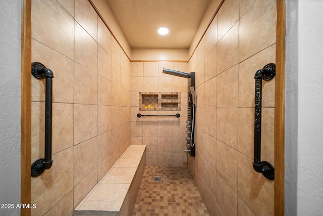 full bathroom featuring a tile shower