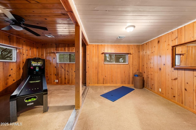 exercise room featuring wooden ceiling, carpet, and visible vents