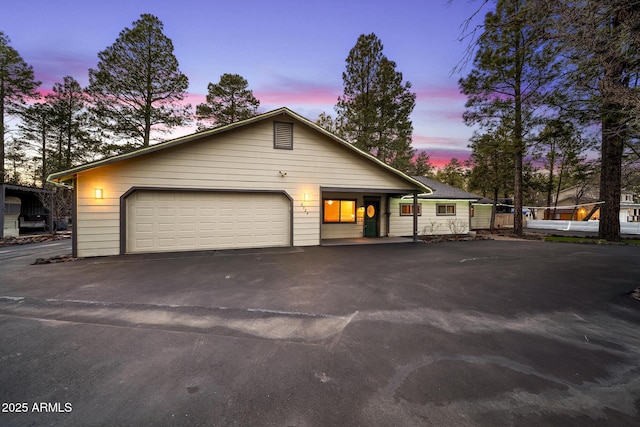 view of front facade featuring driveway and a garage