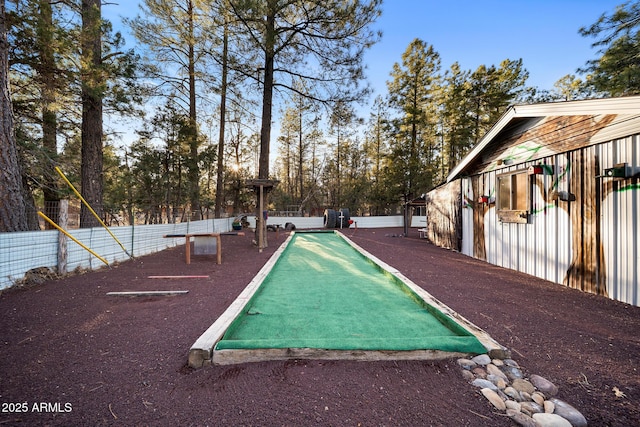 view of property's community featuring fence