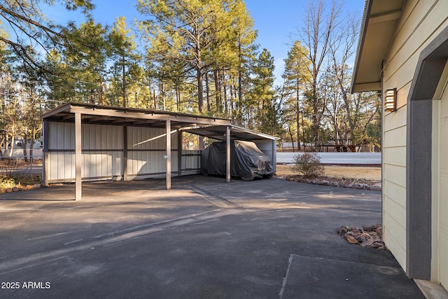 view of vehicle parking with a detached carport