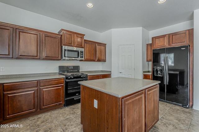kitchen with black appliances, light countertops, recessed lighting, and a kitchen island