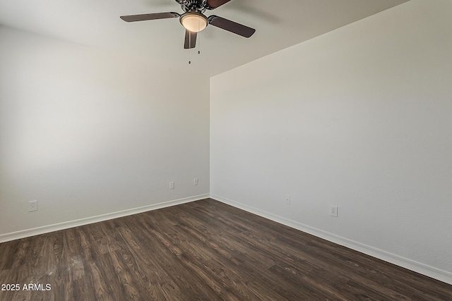 unfurnished room with baseboards, dark wood-style flooring, and a ceiling fan