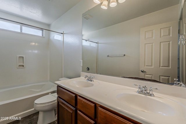 full bath with a sink, bathing tub / shower combination, toilet, and double vanity