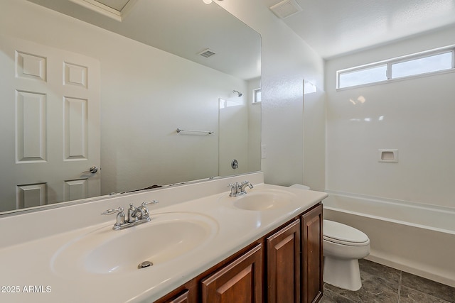 bathroom featuring toilet, visible vents, and a sink