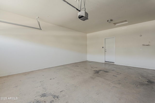 garage featuring baseboards and a garage door opener