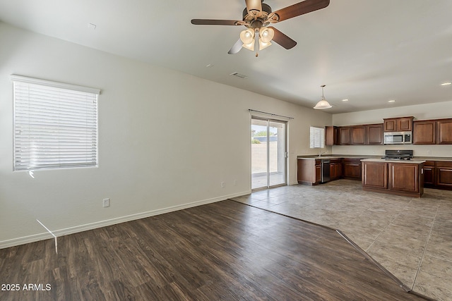 unfurnished living room with recessed lighting, baseboards, ceiling fan, visible vents, and light wood-type flooring