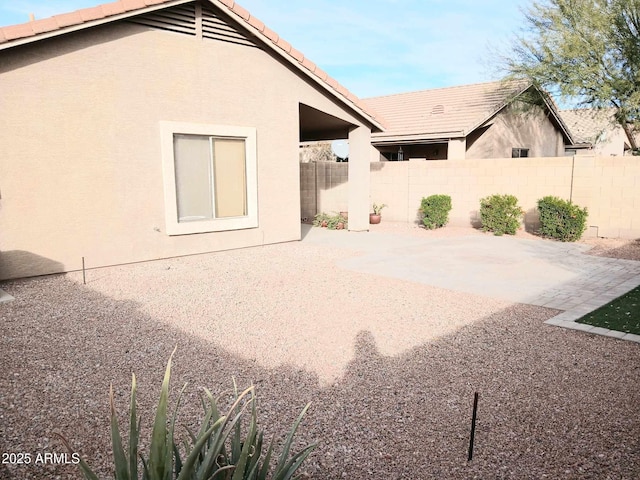 rear view of property featuring a patio area