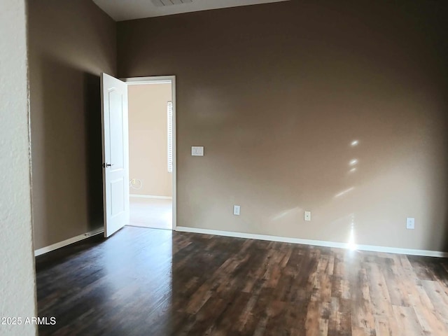 empty room featuring hardwood / wood-style floors