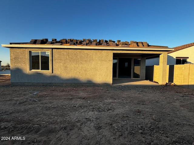 rear view of property featuring a patio area