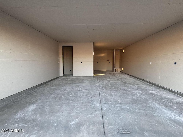 unfurnished room featuring concrete floors