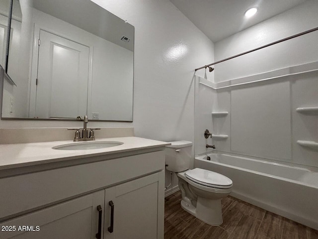 full bathroom with hardwood / wood-style flooring, shower / bath combination, toilet, and vanity