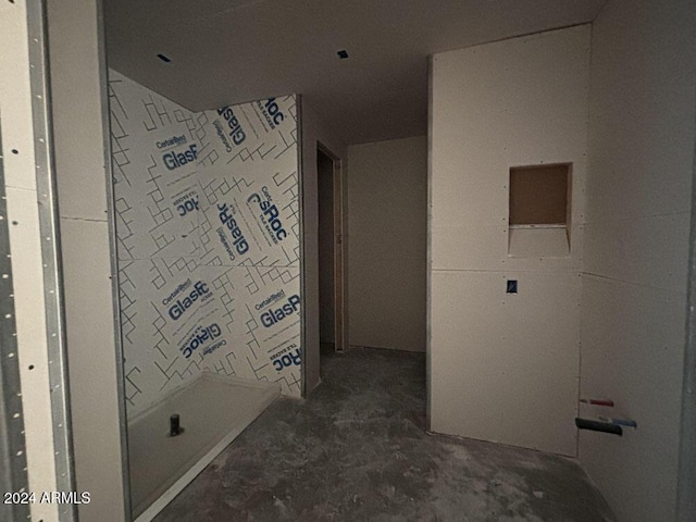 bathroom with concrete flooring