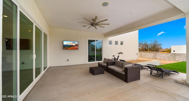 view of patio with ceiling fan and an outdoor living space