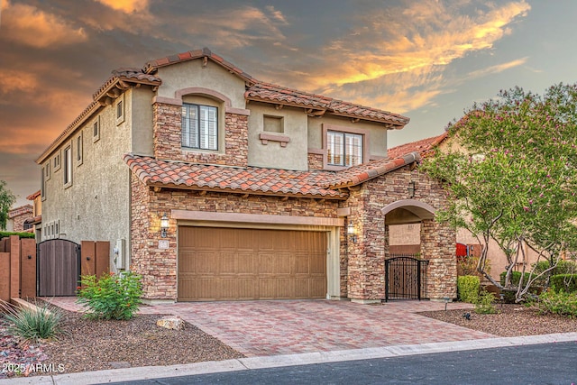 7252 E Nance St, Mesa, AZ 85207 - mediterranean / spanish home featuring a gate, a garage, and stucco siding