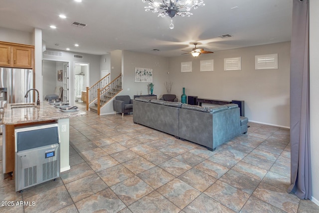 7252 E Nance St, Mesa, AZ 85207 - living area with a ceiling fan, stairway, light stone finish flooring, and recessed lighting