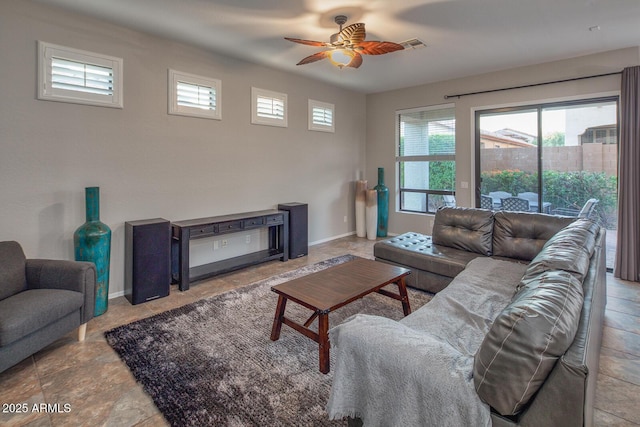 7252 E Nance St, Mesa, AZ 85207 - living area with a ceiling fan and stone finish floors