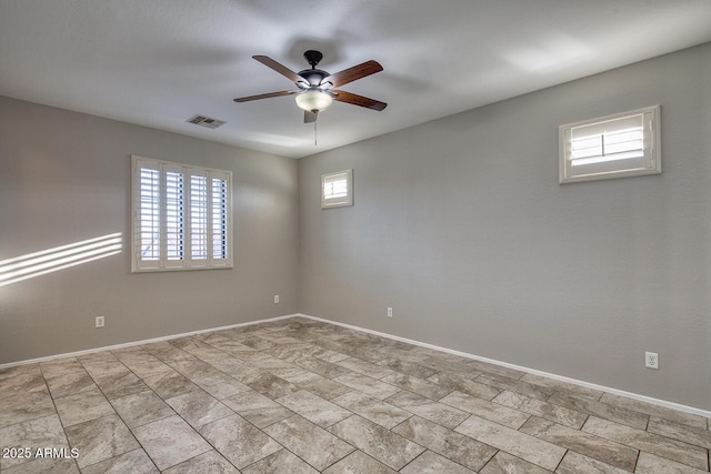 7252 E Nance St, Mesa, AZ 85207 - spare room with a ceiling fan and baseboards