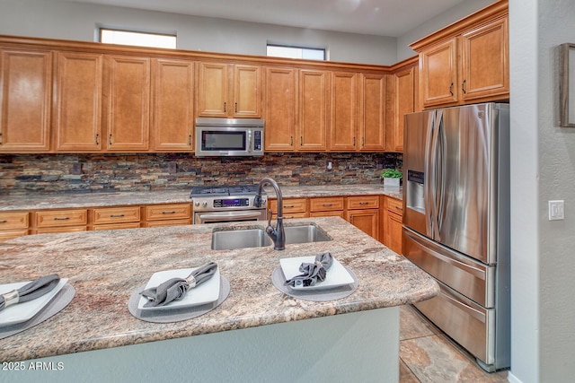 7252 E Nance St, Mesa, AZ 85207 - kitchen with appliances with stainless steel finishes, tasteful backsplash, healthy amount of natural light, and light stone countertops
