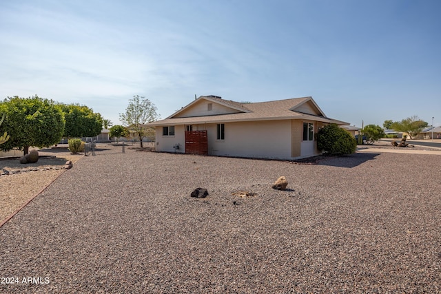 ranch-style home with brick siding and fence