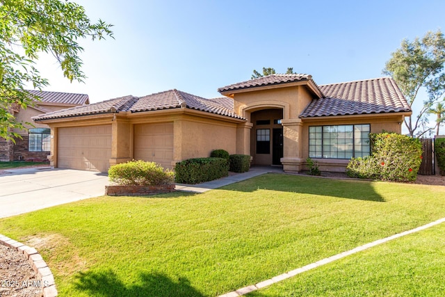 3002 S Marigold Pl, Chandler, AZ 85248 - mediterranean / spanish-style home featuring an attached garage, stucco siding, a tile roof, concrete driveway, and a front yard