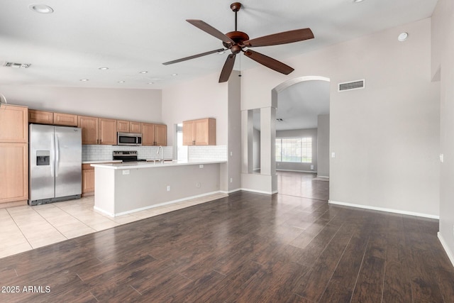 3002 S Marigold Pl, Chandler, AZ 85248 - unfurnished living room with a sink, arched walkways, a ceiling fan, and visible vents