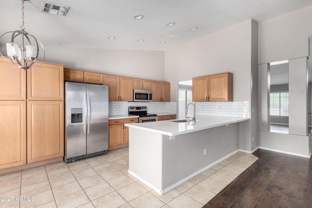 3002 S Marigold Pl, Chandler, AZ 85248 - kitchen featuring a sink, stainless steel appliances, high vaulted ceiling, visible vents, and a chandelier