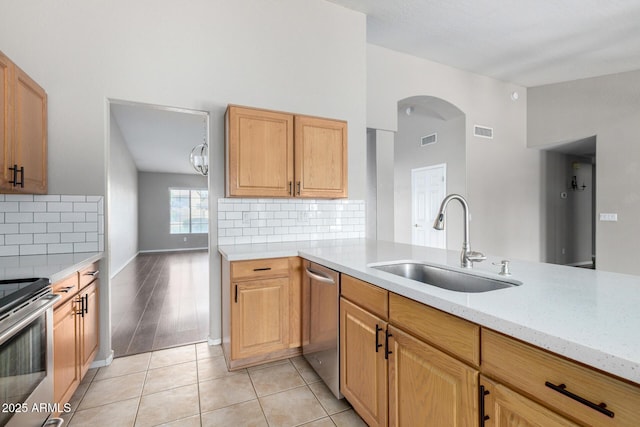 3002 S Marigold Pl, Chandler, AZ 85248 - kitchen with stainless steel appliances, visible vents, arched walkways, and a sink