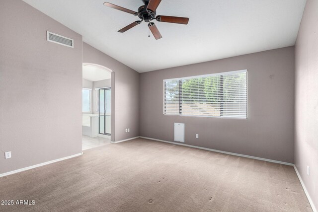 3002 S Marigold Pl, Chandler, AZ 85248 - unfurnished room featuring arched walkways, visible vents, carpet floors, and vaulted ceiling