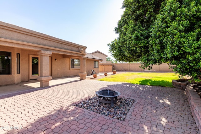 3002 S Marigold Pl, Chandler, AZ 85248 - view of patio / terrace featuring a fire pit and a fenced backyard