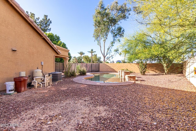 3002 S Marigold Pl, Chandler, AZ 85248 - view of yard with cooling unit, a fenced in pool, and a fenced backyard