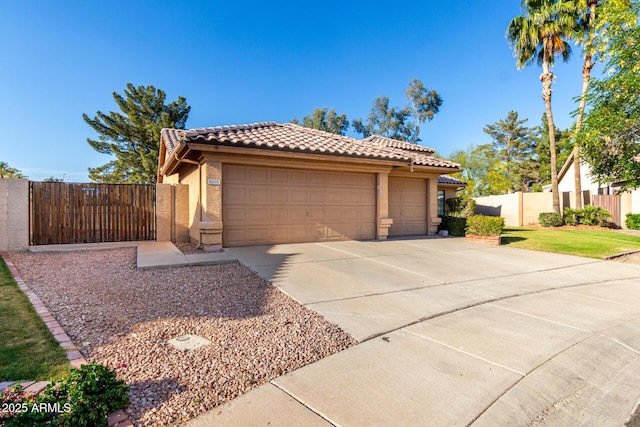 3002 S Marigold Pl, Chandler, AZ 85248 - view of front of property featuring a tiled roof, fence, stucco siding, concrete driveway, and a gate