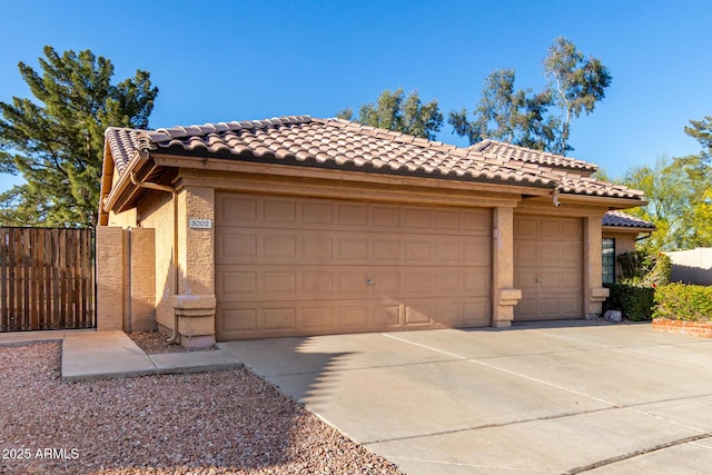3002 S Marigold Pl, Chandler, AZ 85248 - garage featuring concrete driveway and fence