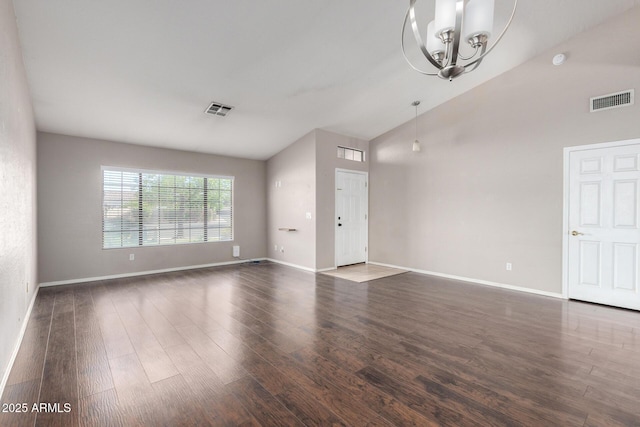 3002 S Marigold Pl, Chandler, AZ 85248 - unfurnished living room with lofted ceiling, a notable chandelier, baseboards, dark wood finished floors, and visible vents