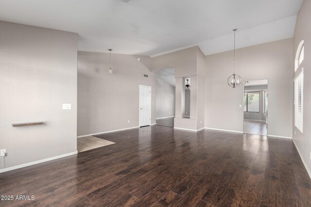 3002 S Marigold Pl, Chandler, AZ 85248 - unfurnished living room featuring wood finished floors, baseboards, and high vaulted ceiling