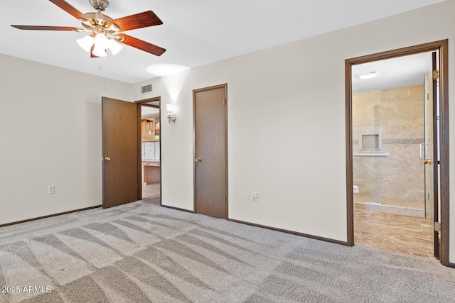 unfurnished bedroom featuring connected bathroom, baseboards, visible vents, and carpet
