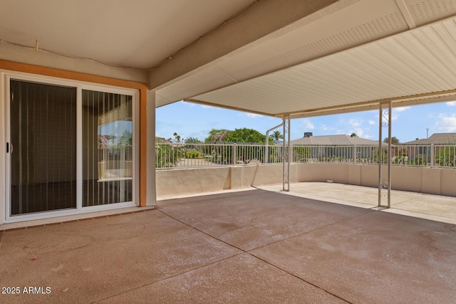 view of patio / terrace featuring fence
