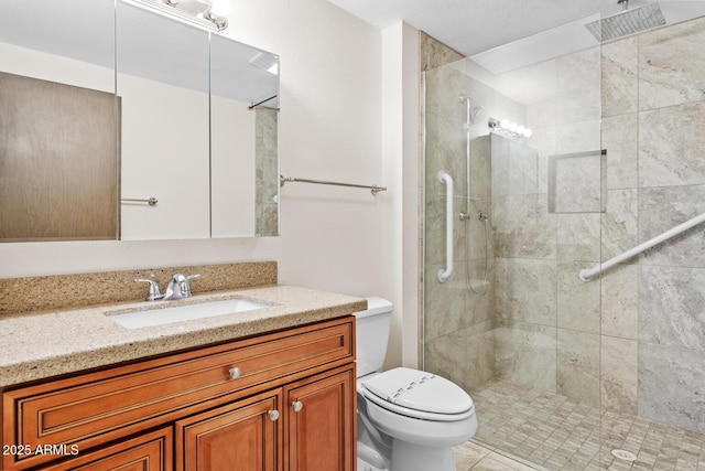 full bathroom with vanity, toilet, and tiled shower